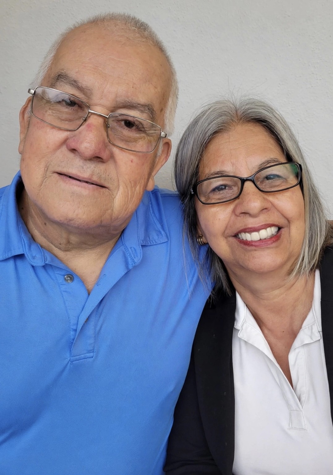 An older couple reviewing documents together at home